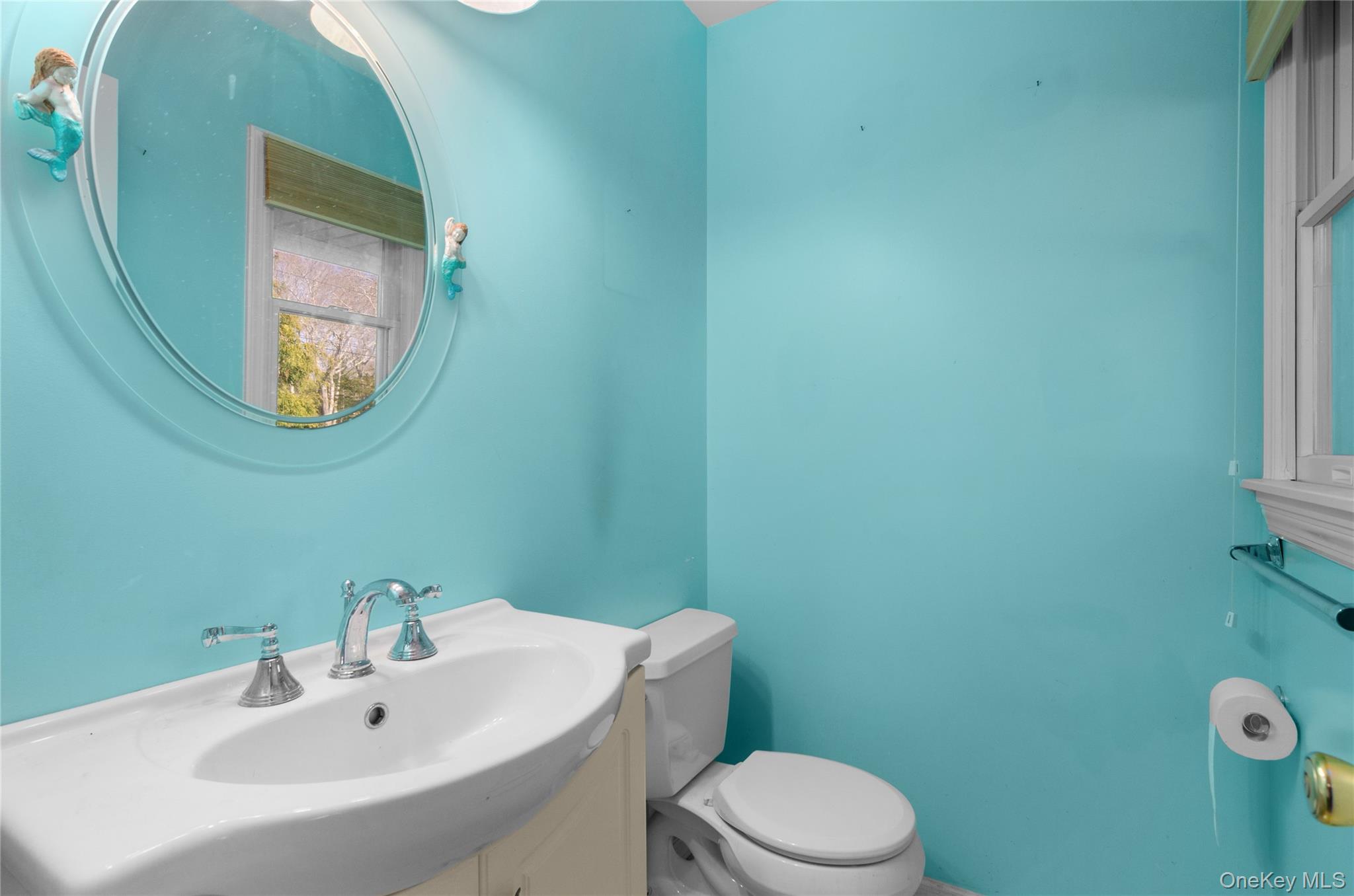 26 Lovell Road Hampton Bays, NY 11946 - Photo 8 of 25 powder room off the entry