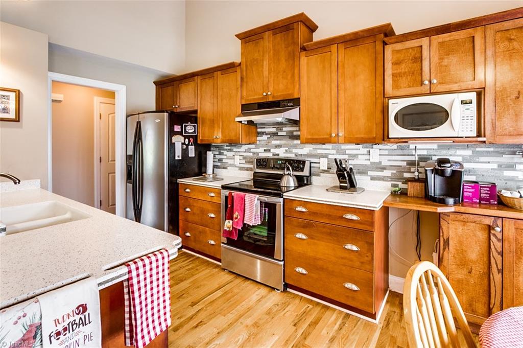 240 Deerfield Country Road Randleman, NC 27317 - Photo 8 of 27 Kitchen, hardwood floors, tile back-splash