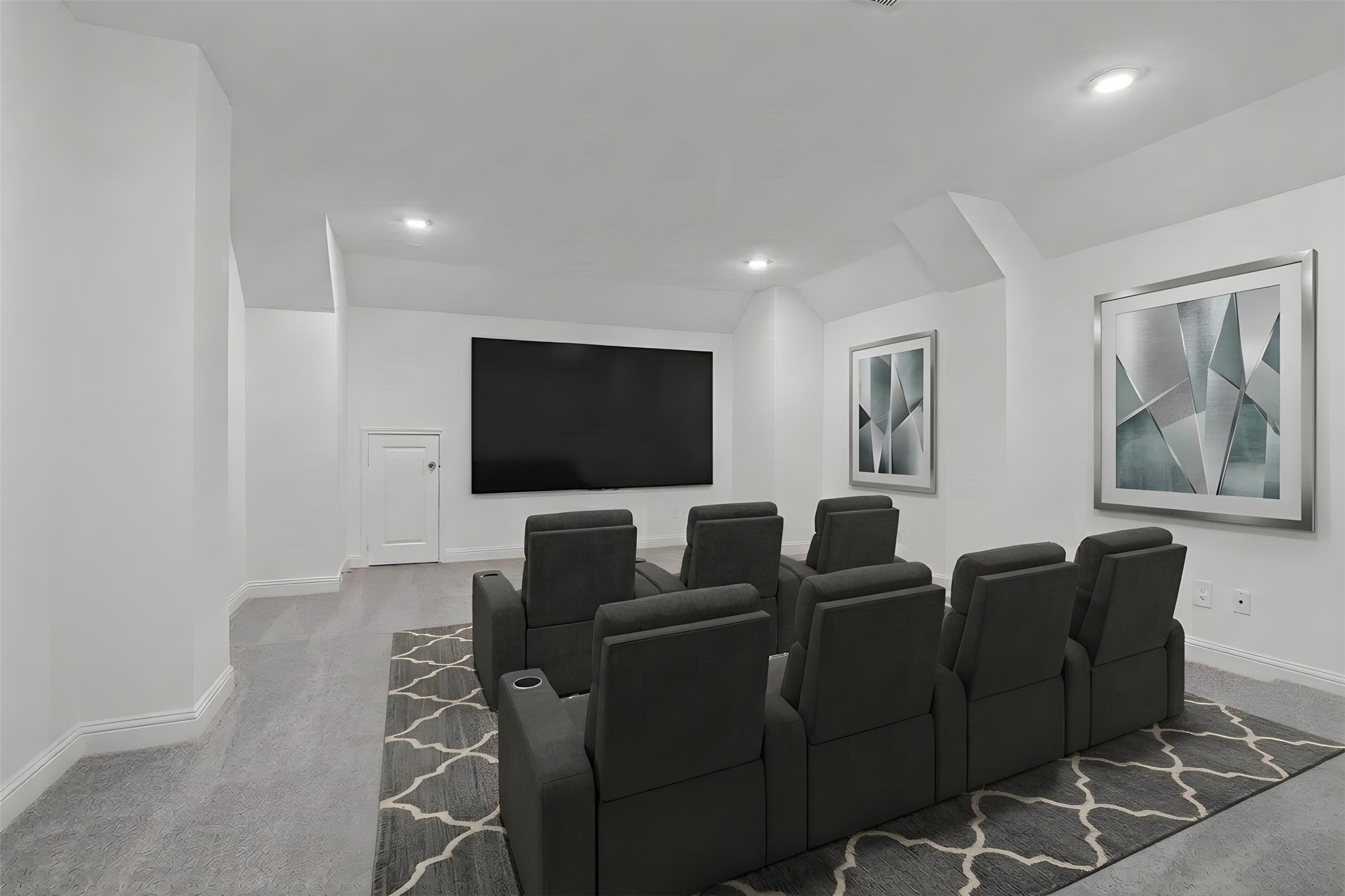 17315 July Moon Lane Conroe, TX 77302 - Photo 35 of 46 Grab the popcorn, put on a movie, and enjoy a wonderful evening in your amazing media room! Featuring plush carpet, custom paint, custom lighting makes this the perfect room for relaxing! *Virtually Staged