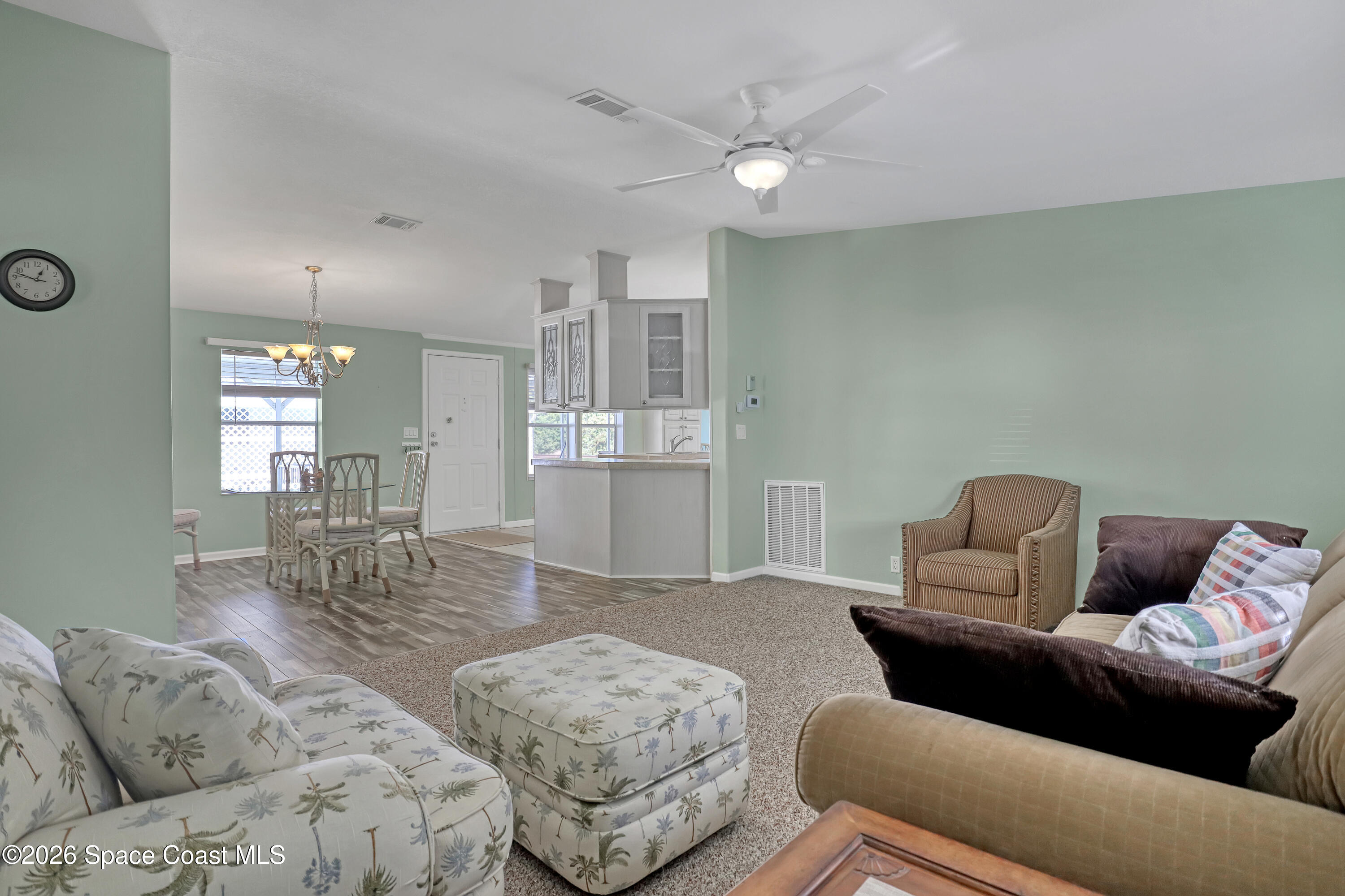 7547 Boxelder Road Micco, FL 32976 - Photo 12 of 53 a living room with furniture and wooden floor