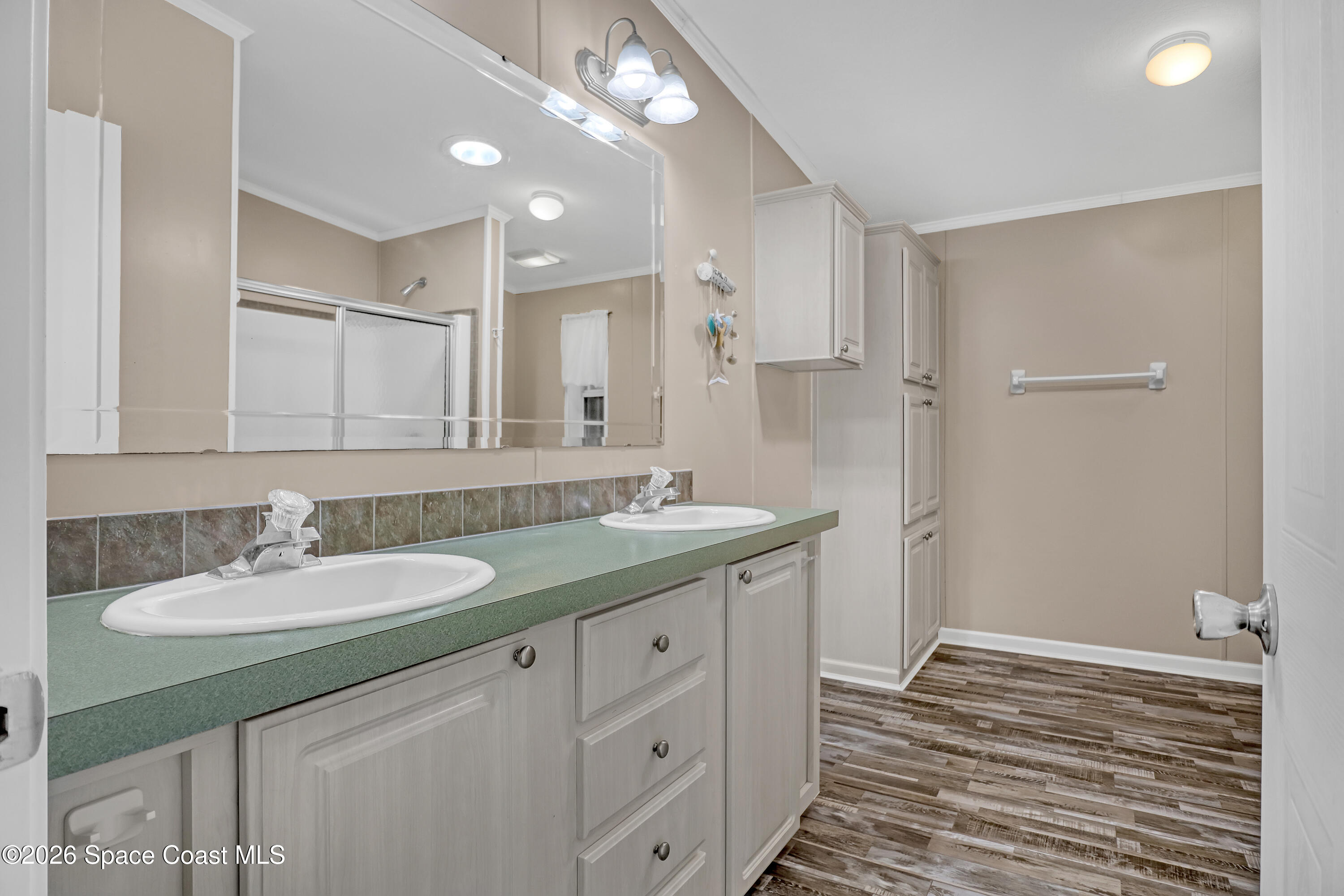 7547 Boxelder Road Micco, FL 32976 - Photo 26 of 53 a bathroom with a sink double vanity and a mirror