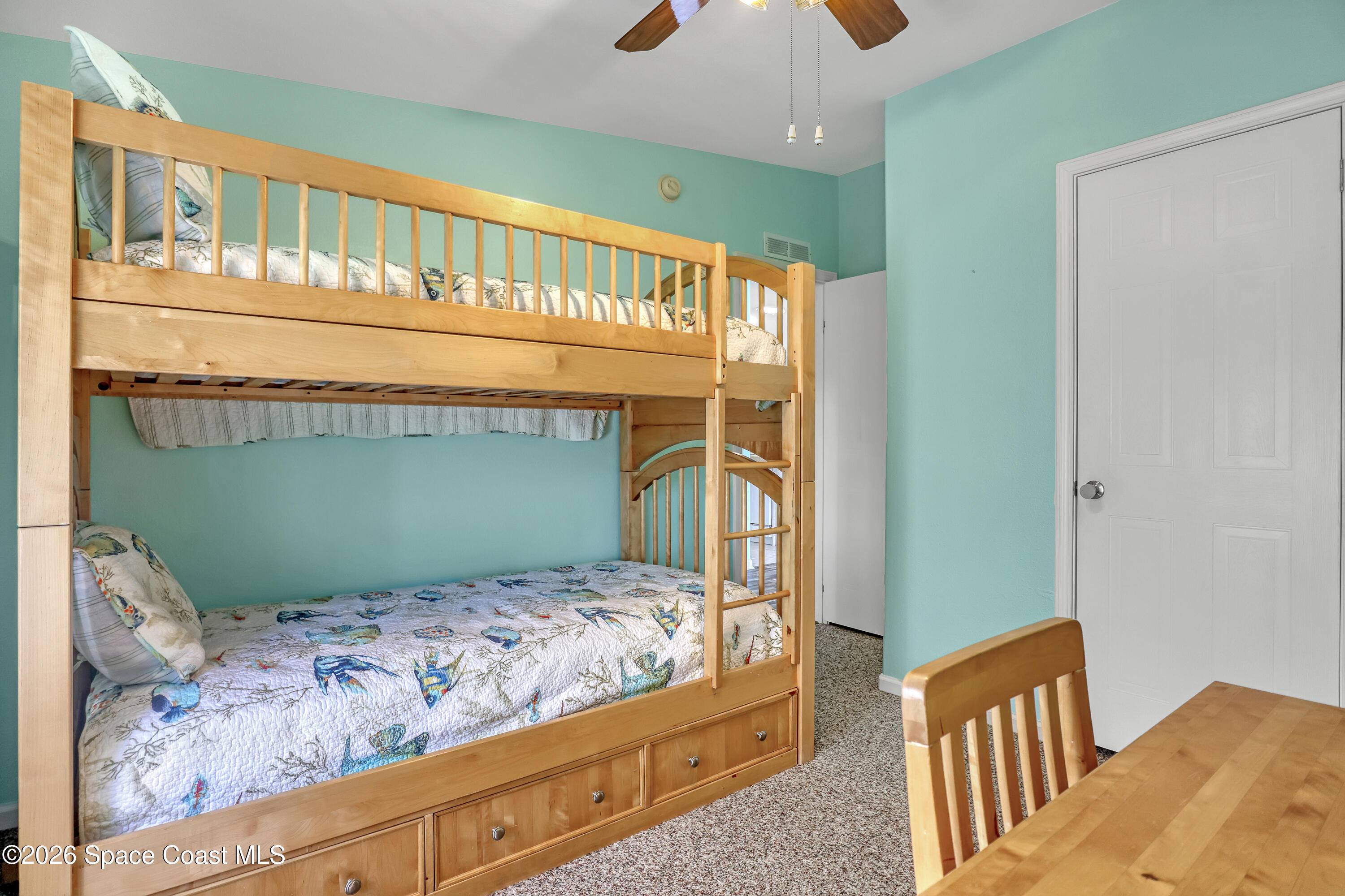 7547 Boxelder Road Micco, FL 32976 - Photo 30 of 53 a bedroom with bed and a large window