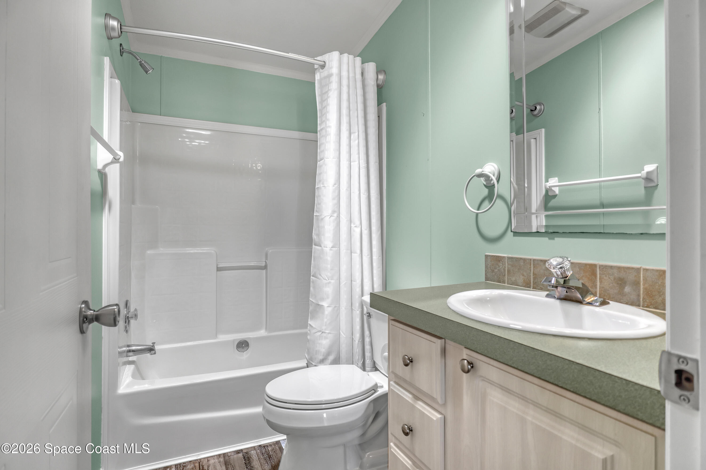 7547 Boxelder Road Micco, FL 32976 - Photo 31 of 53 a bathroom with a sink toilet and shower