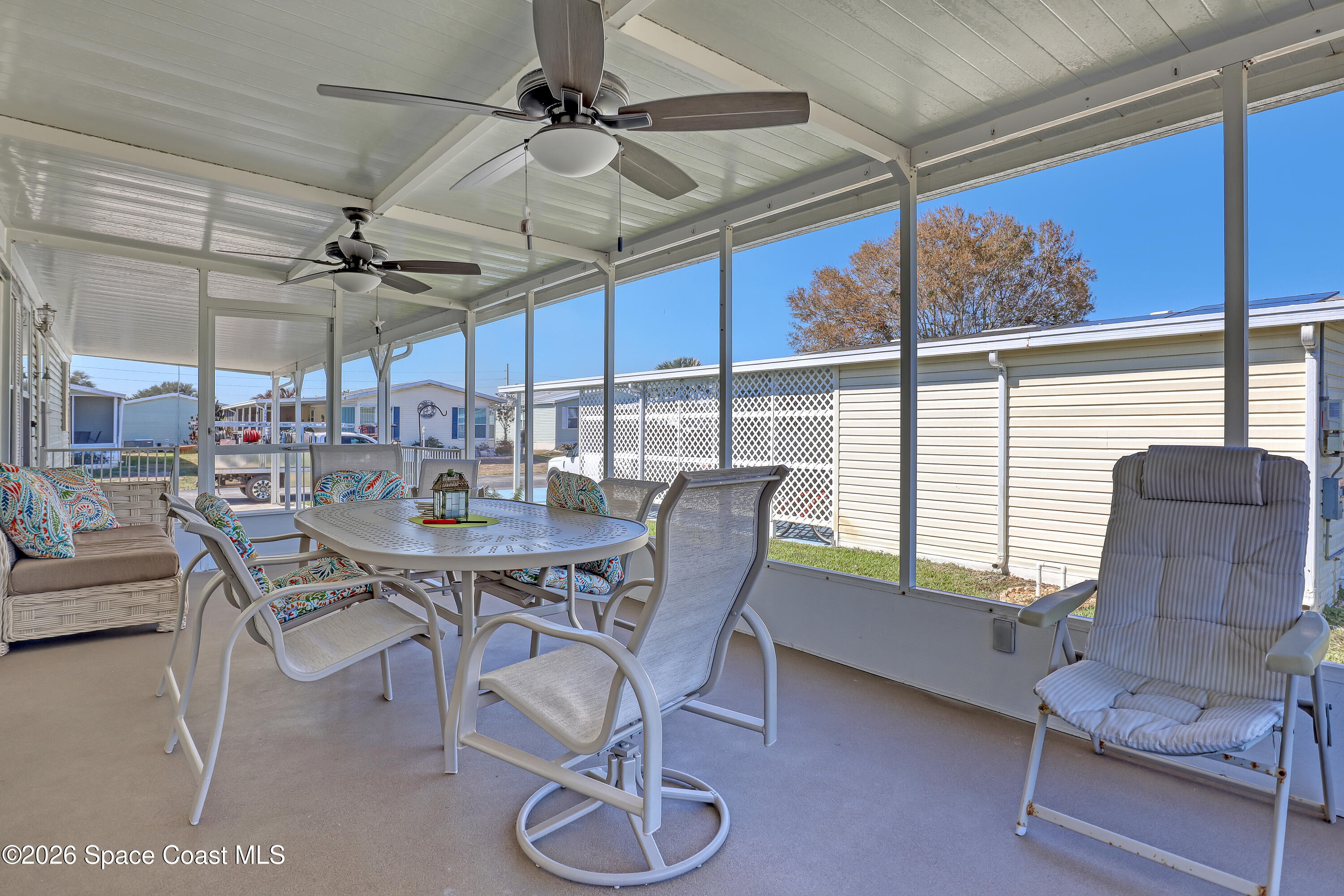 7547 Boxelder Road Micco, FL 32976 - Photo 34 of 53 a view of a dining room with furniture window and outside view