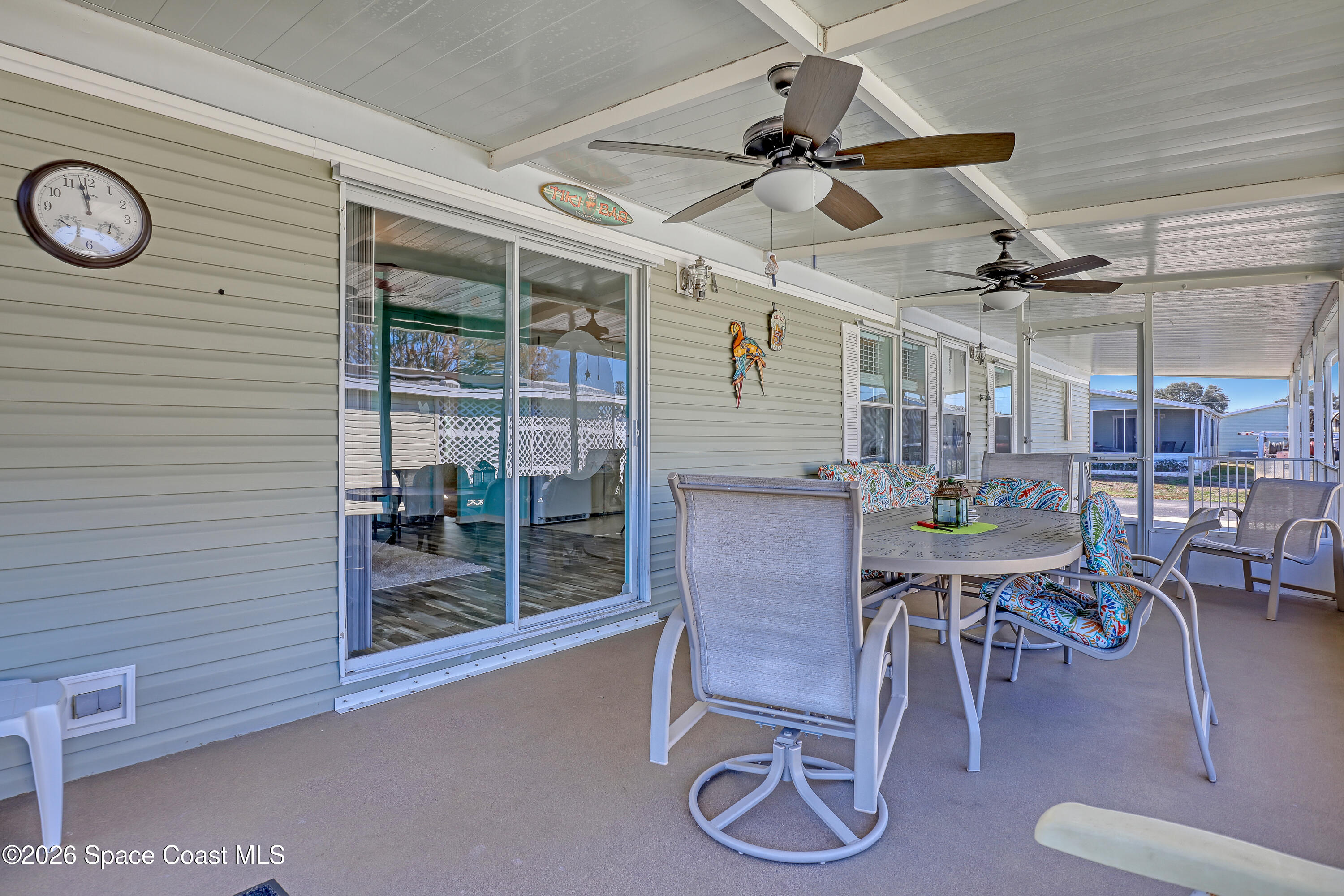 7547 Boxelder Road Micco, FL 32976 - Photo 35 of 53 a view of a room with furniture and a table