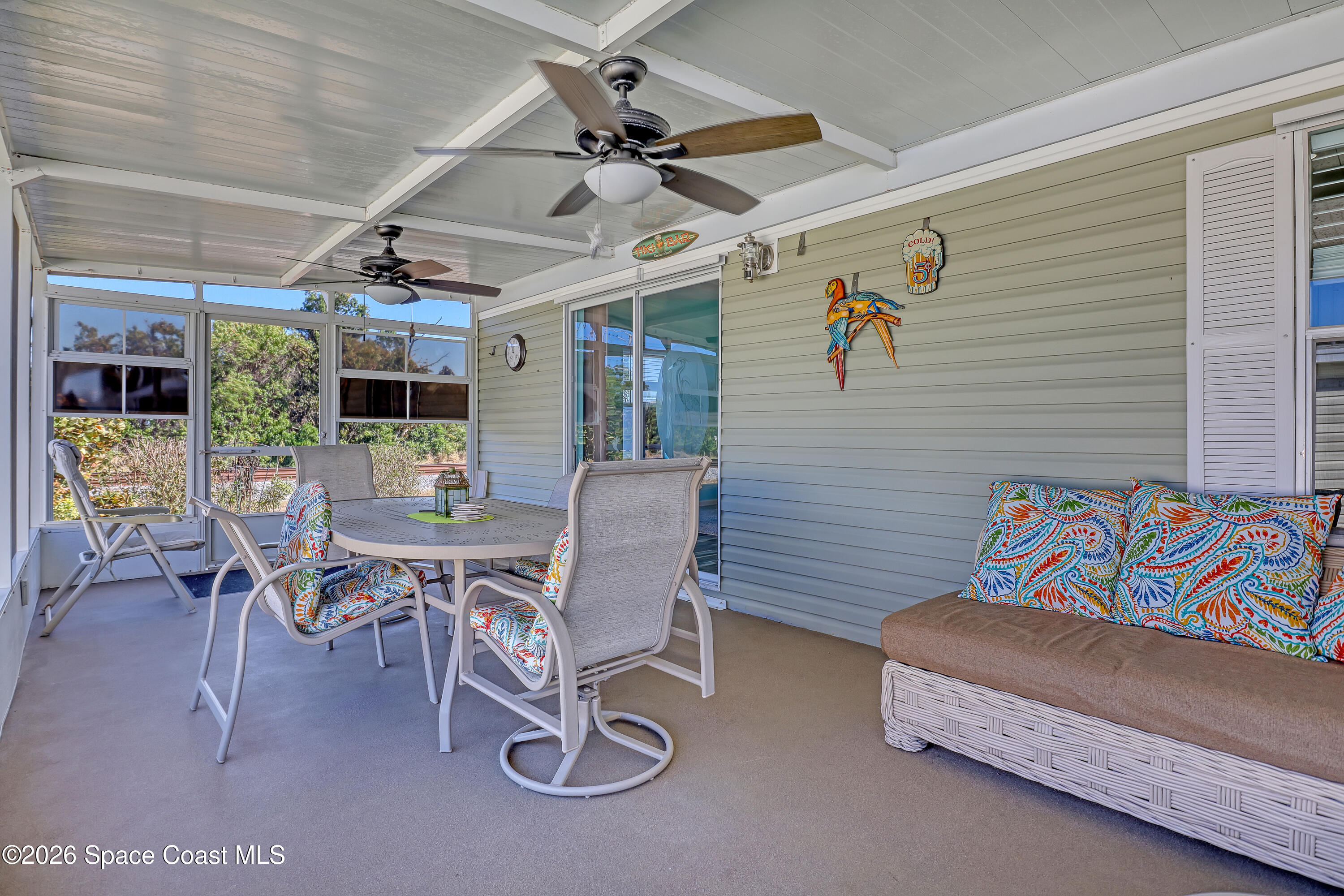 7547 Boxelder Road Micco, FL 32976 - Photo 36 of 53 a view of a patio with a table and chairs
