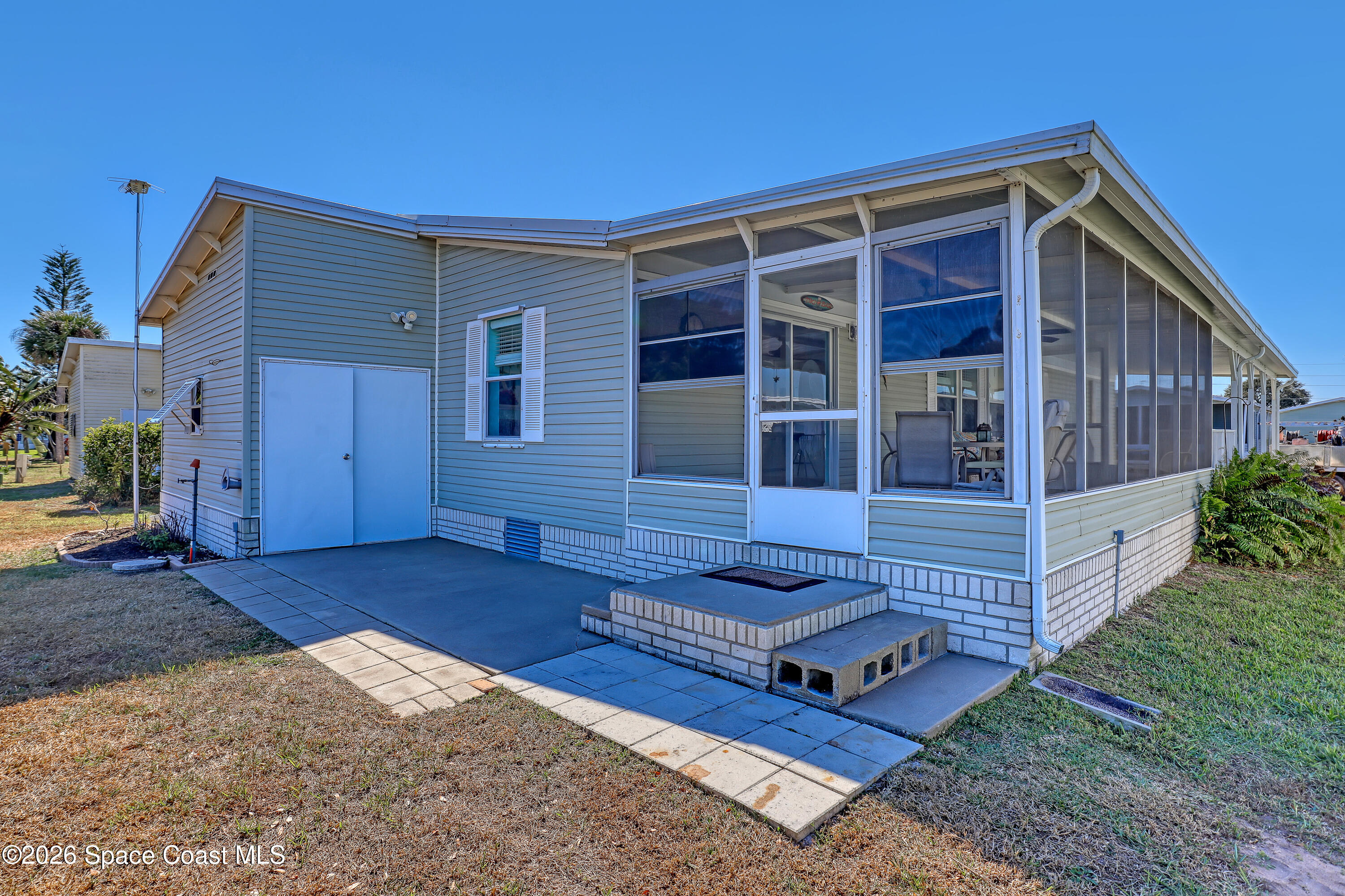 7547 Boxelder Road Micco, FL 32976 - Photo 37 of 53 front view of a house with a yard