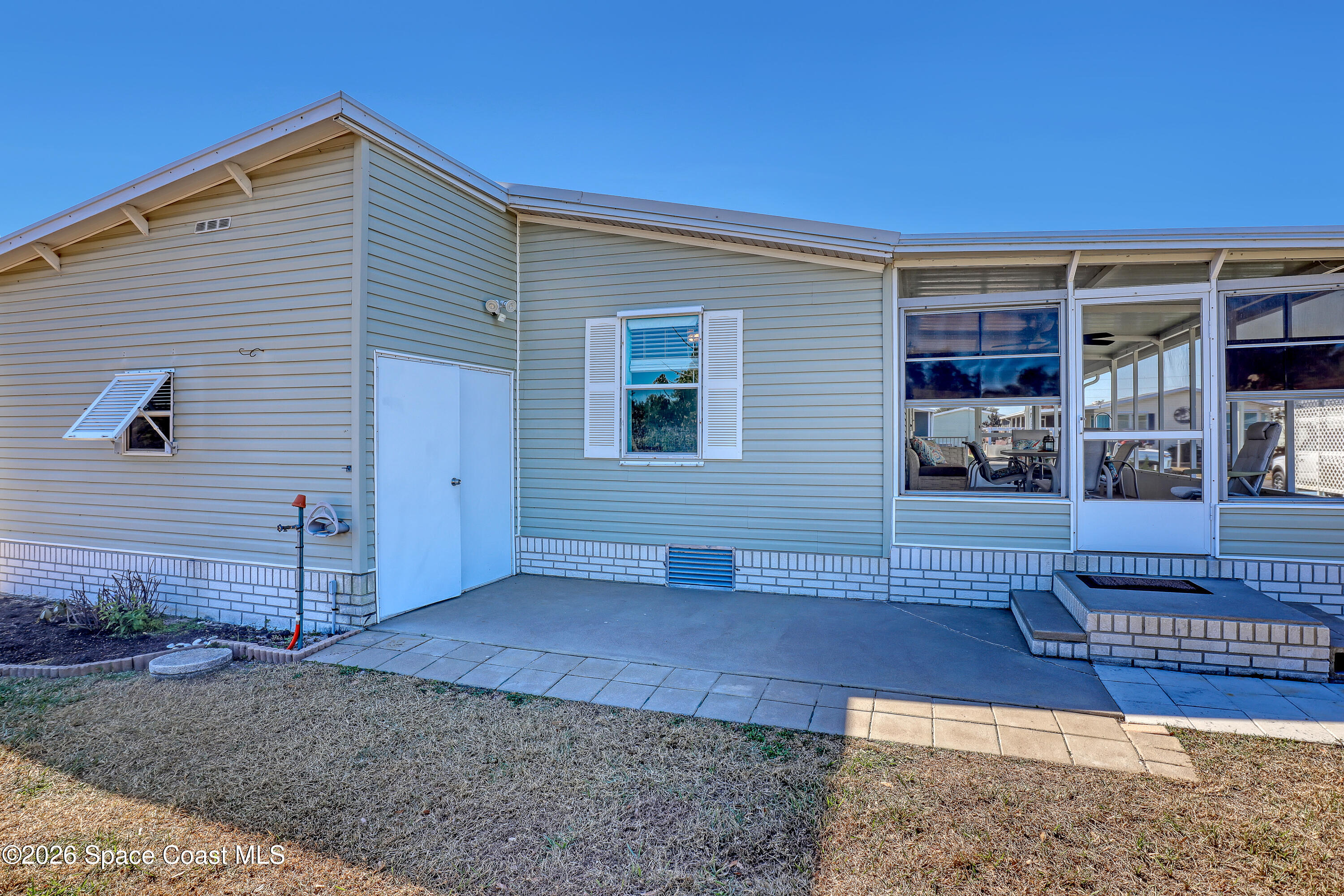 7547 Boxelder Road Micco, FL 32976 - Photo 39 of 53 a view of a house with wooden fence