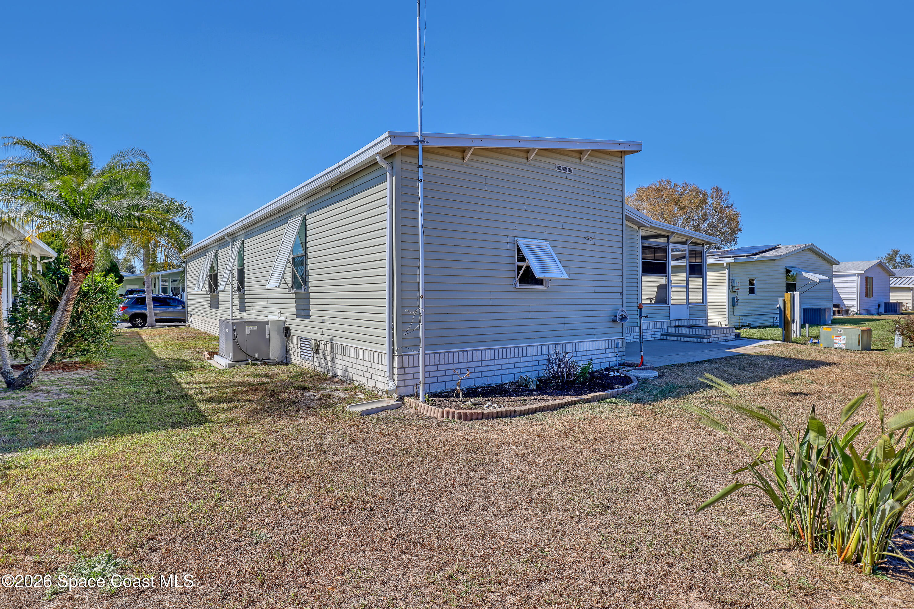 7547 Boxelder Road Micco, FL 32976 - Photo 41 of 53 a view of a house with a yard