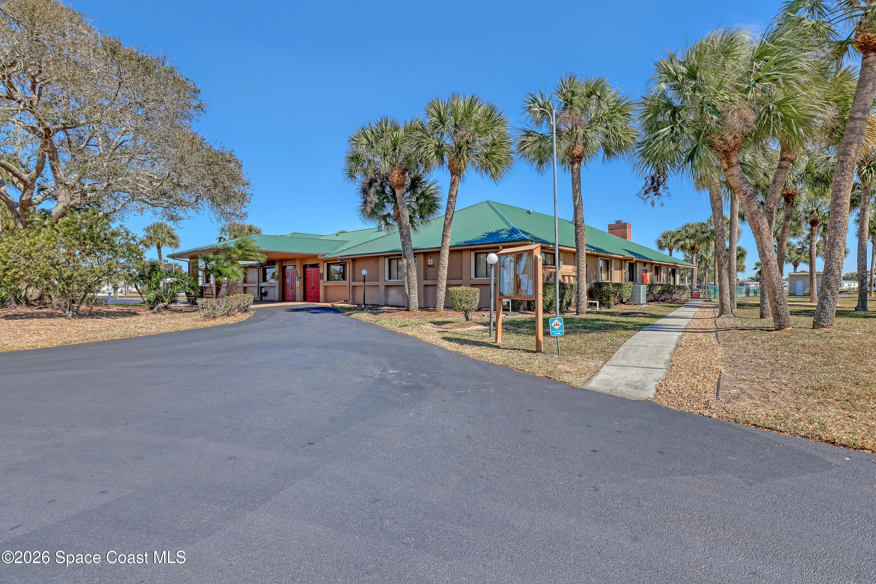 7547 Boxelder Road Micco, FL 32976 - Photo 42 of 53 a view of swimming pool with outdoor seating and trees in the background