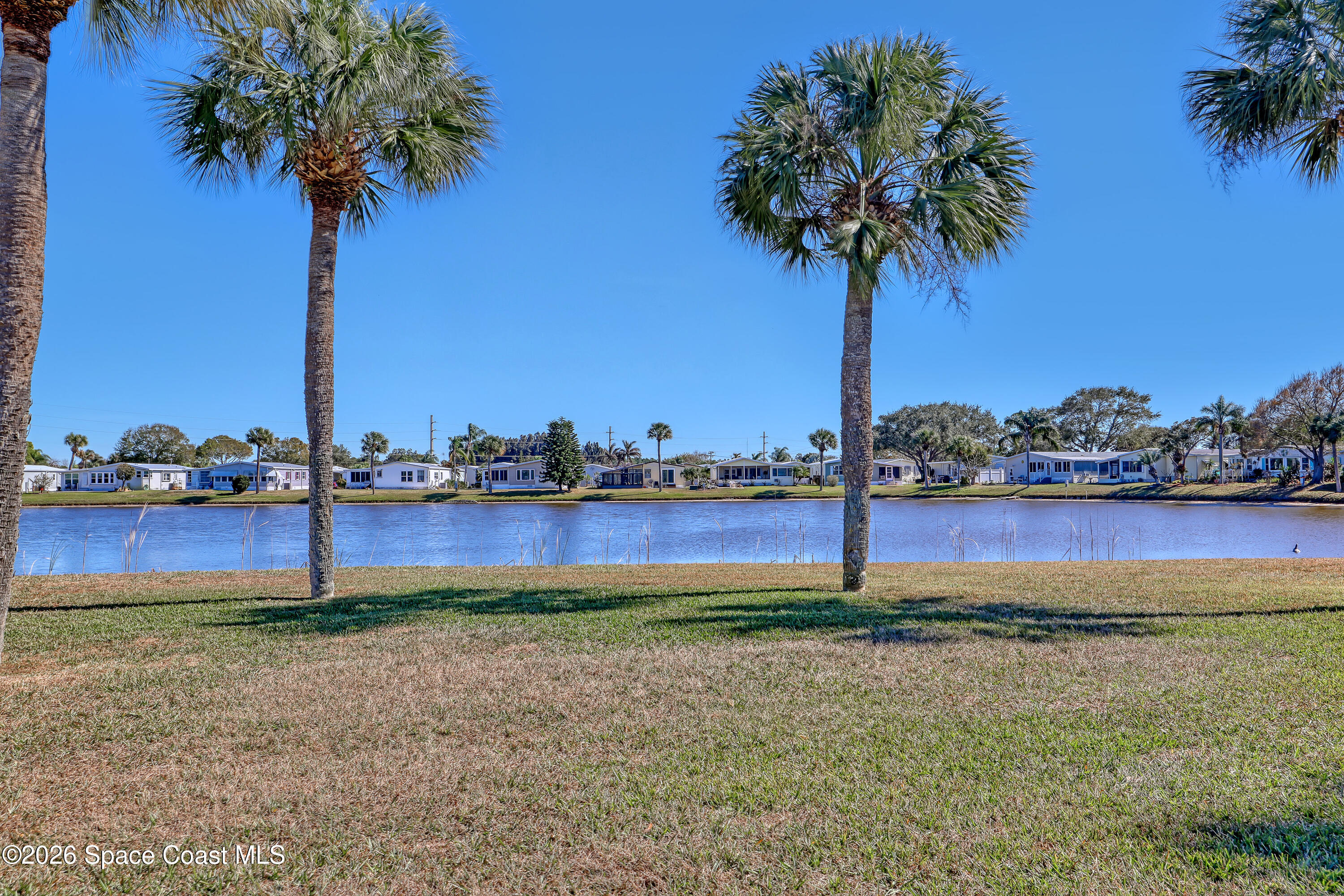 7547 Boxelder Road Micco, FL 32976 - Photo 53 of 53 a house that has a tree in it