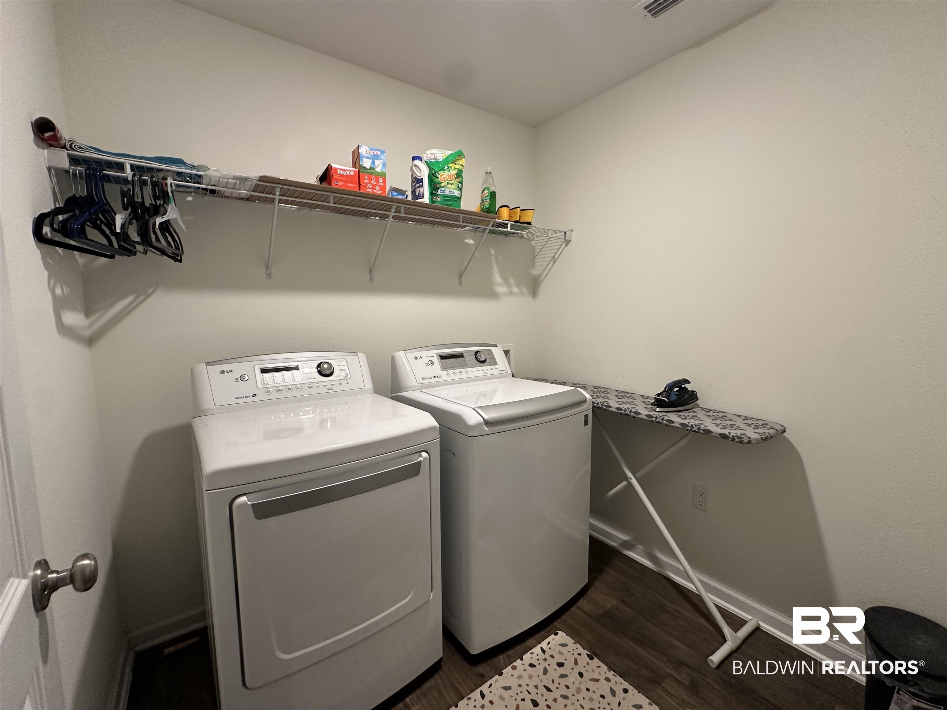 23792 Unbridled Loop Daphne, AL 36526 - Photo 21 of 36 Laundry area with dark wood-style floors and washing machine and dryer