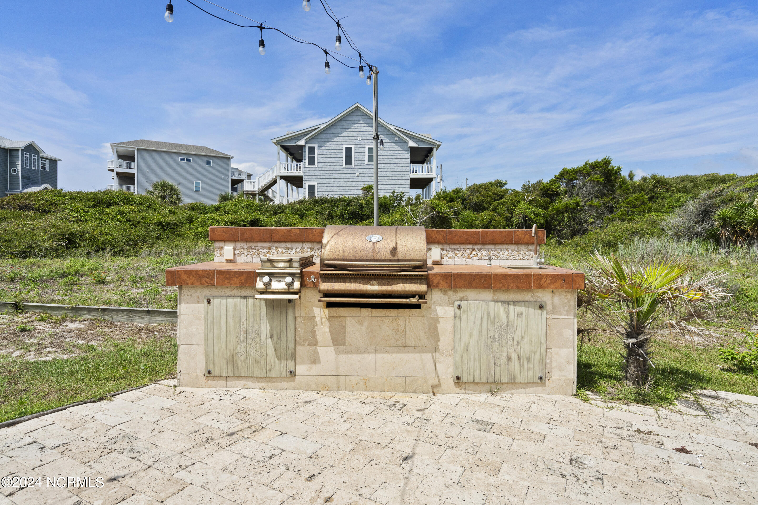 886 New River Inlet Road, Unit 47 North Topsail Beach, NC 28460 - Photo 39 of 54 This is NOT on the property, it is encroaching on the lot behind it