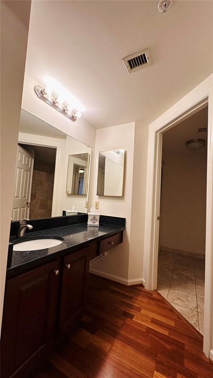 199 14th Street Northeast, Unit 507 Atlanta, GA 30309 - Photo 22 of 26 a kitchen with granite countertop a sink and a stove