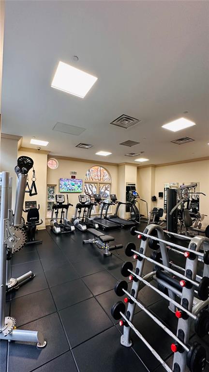 199 14th Street Northeast, Unit 507 Atlanta, GA 30309 - Photo 8 of 26 a room with gym equipment and a mirror