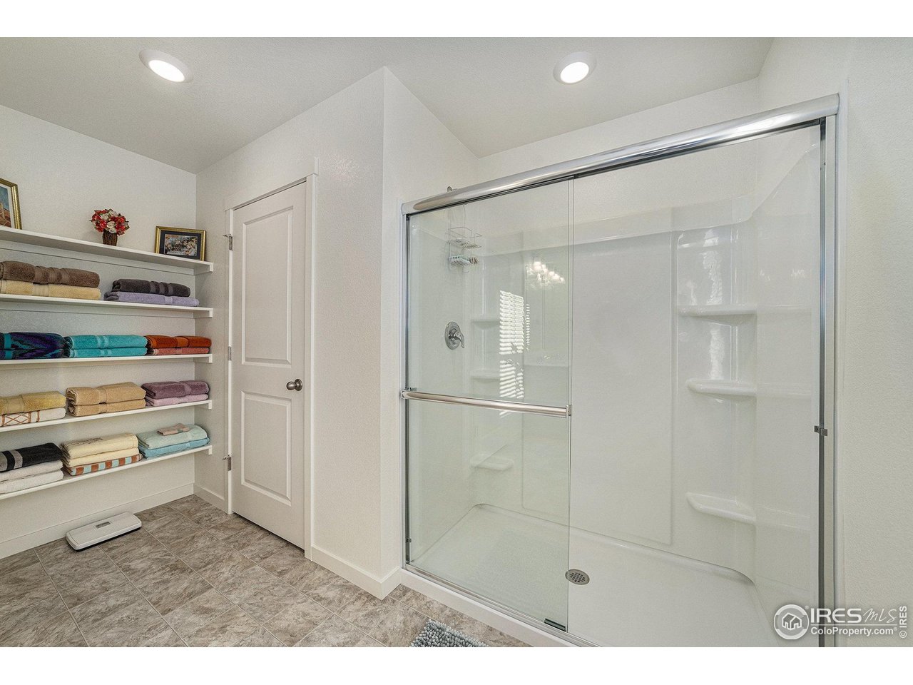 439 Bluebird Road Johnstown, CO 80534 - Photo 23 of 37 a bathroom with a shower and a sink