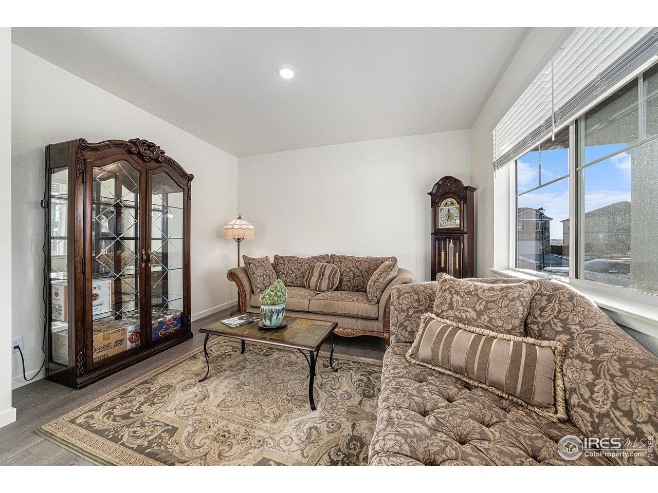 439 Bluebird Road Johnstown, CO 80534 - Photo 7 of 37 a living room with furniture and a large window