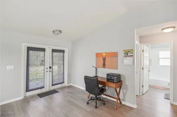 a bedroom with a bed and balcony