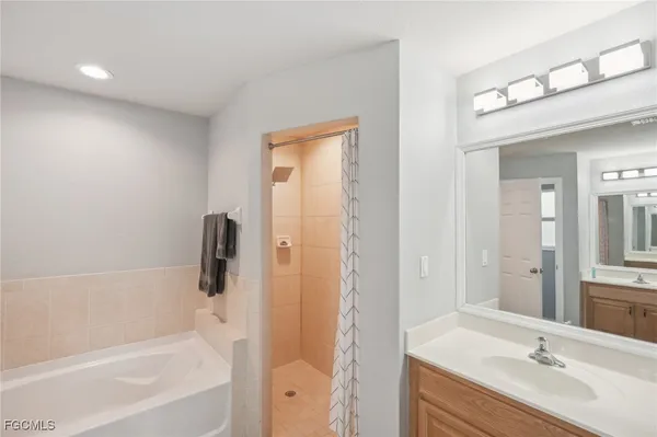 a bathroom with a bathtub toilet and a shower