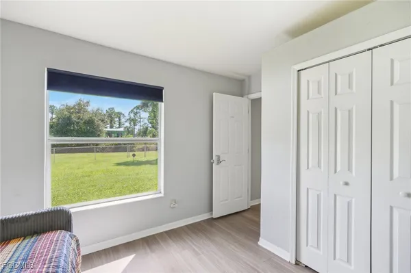 a view of a deck and a backyard