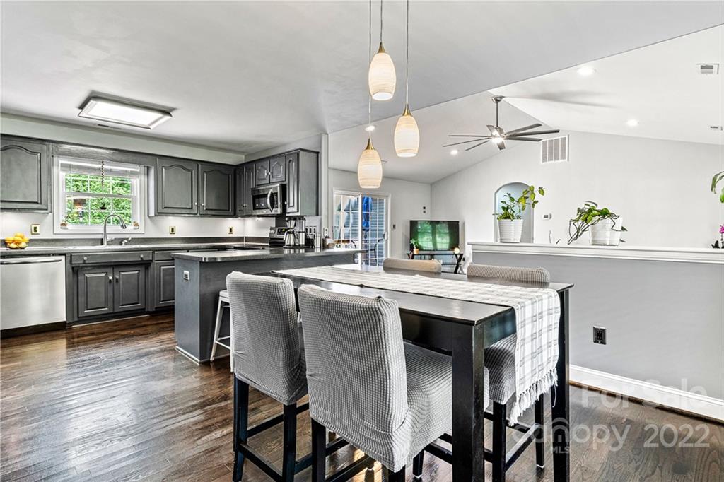 1776 Furnace Road Lincolnton, NC 28092 - Photo 13 of 41 a kitchen with kitchen island a dining table and chairs
