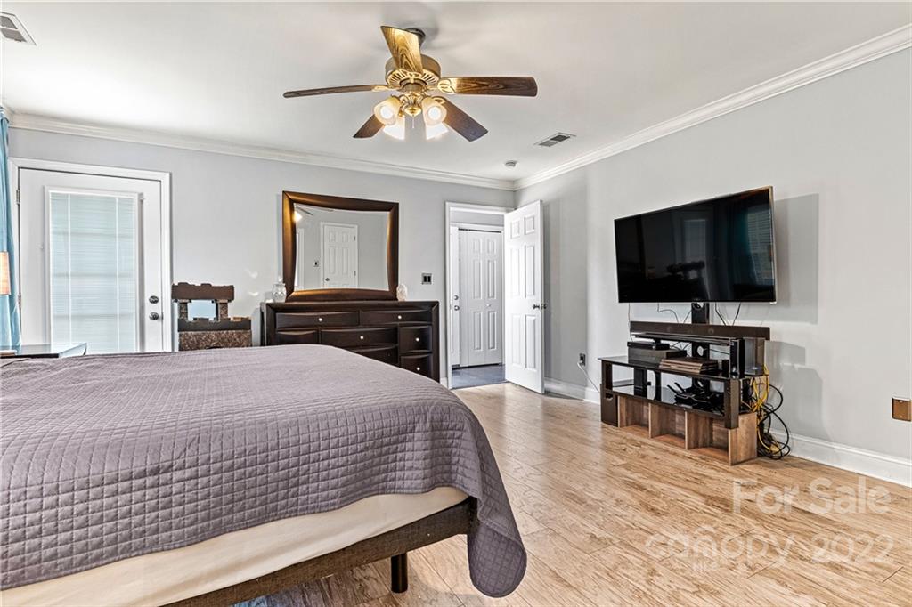 1776 Furnace Road Lincolnton, NC 28092 - Photo 20 of 41 a bedroom with a bed and a flat screen tv