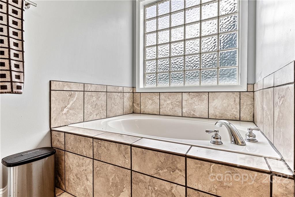 1776 Furnace Road Lincolnton, NC 28092 - Photo 22 of 41 a bath tub sitting next to a window