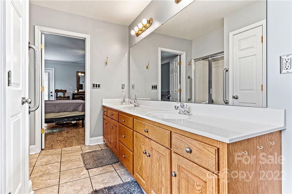 1776 Furnace Road Lincolnton, NC 28092 - Photo 23 of 41 a spacious bathroom with double vanity and a mirror