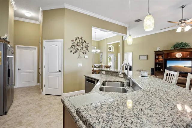 a bedroom with a bed and a mirror on the dresser