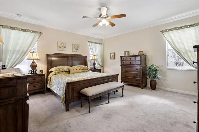 a bedroom with a bed dresser and a window