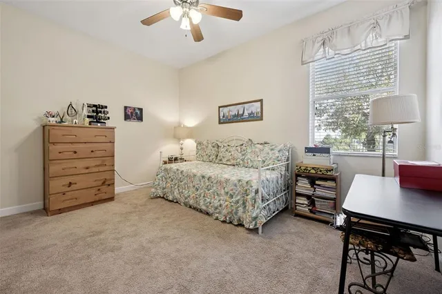 a bedroom with a bed and a table