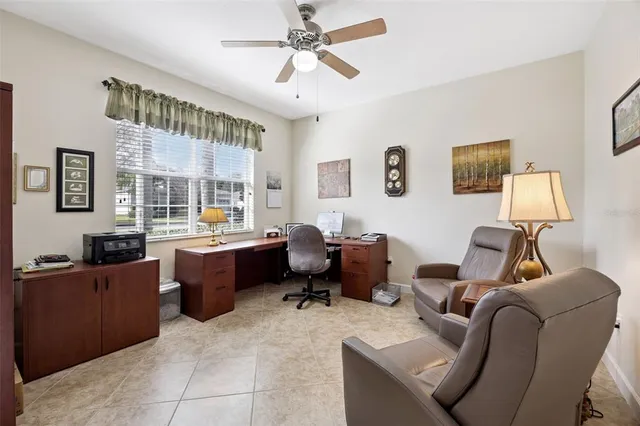 a view of a livingroom with workspace and a couch