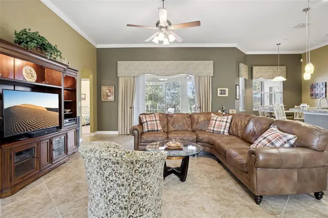 a living room with fireplace furniture and a flat screen tv