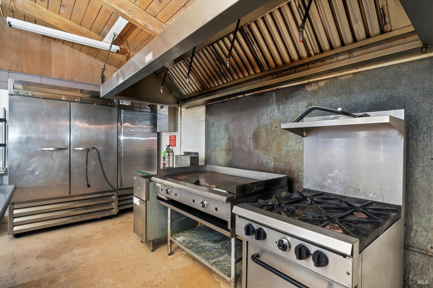 3794 Highway 20 Nice, CA 95464 - Photo 35 of 36 a stove top oven sitting inside of a kitchen