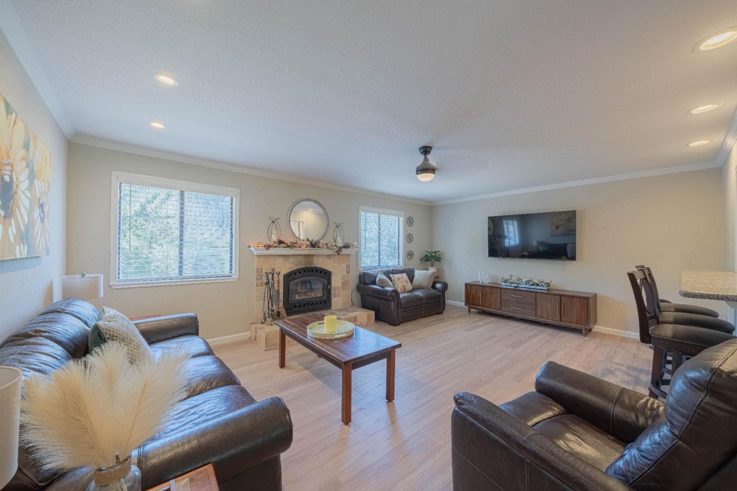 5240 Strong Circle Watsonville, CA 95076 - Photo 12 of 51 a living room with furniture a fireplace and a flat screen tv