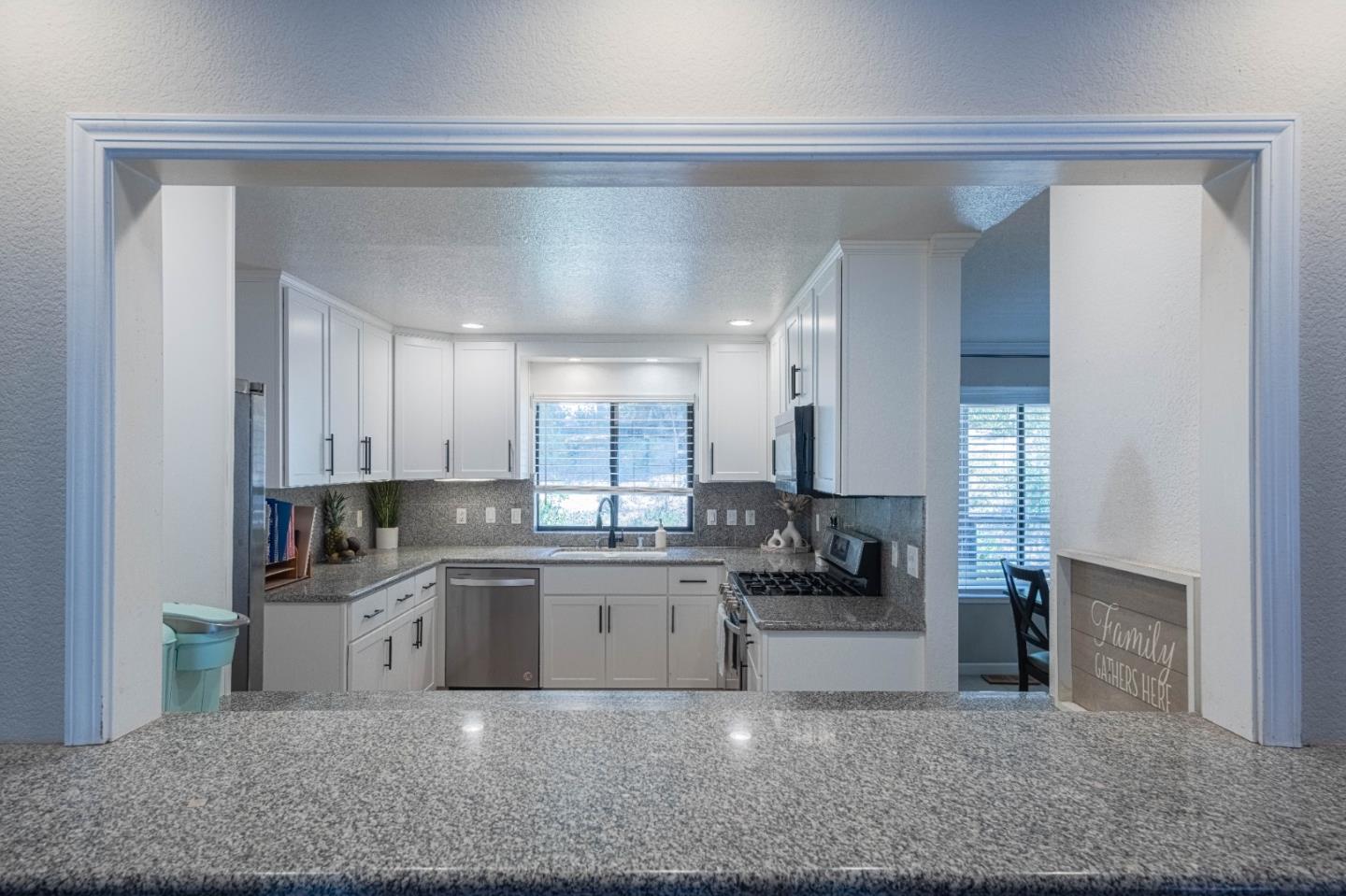 5240 Strong Circle Watsonville, CA 95076 - Photo 18 of 51 a kitchen with stainless steel appliances granite countertop a sink and cabinets