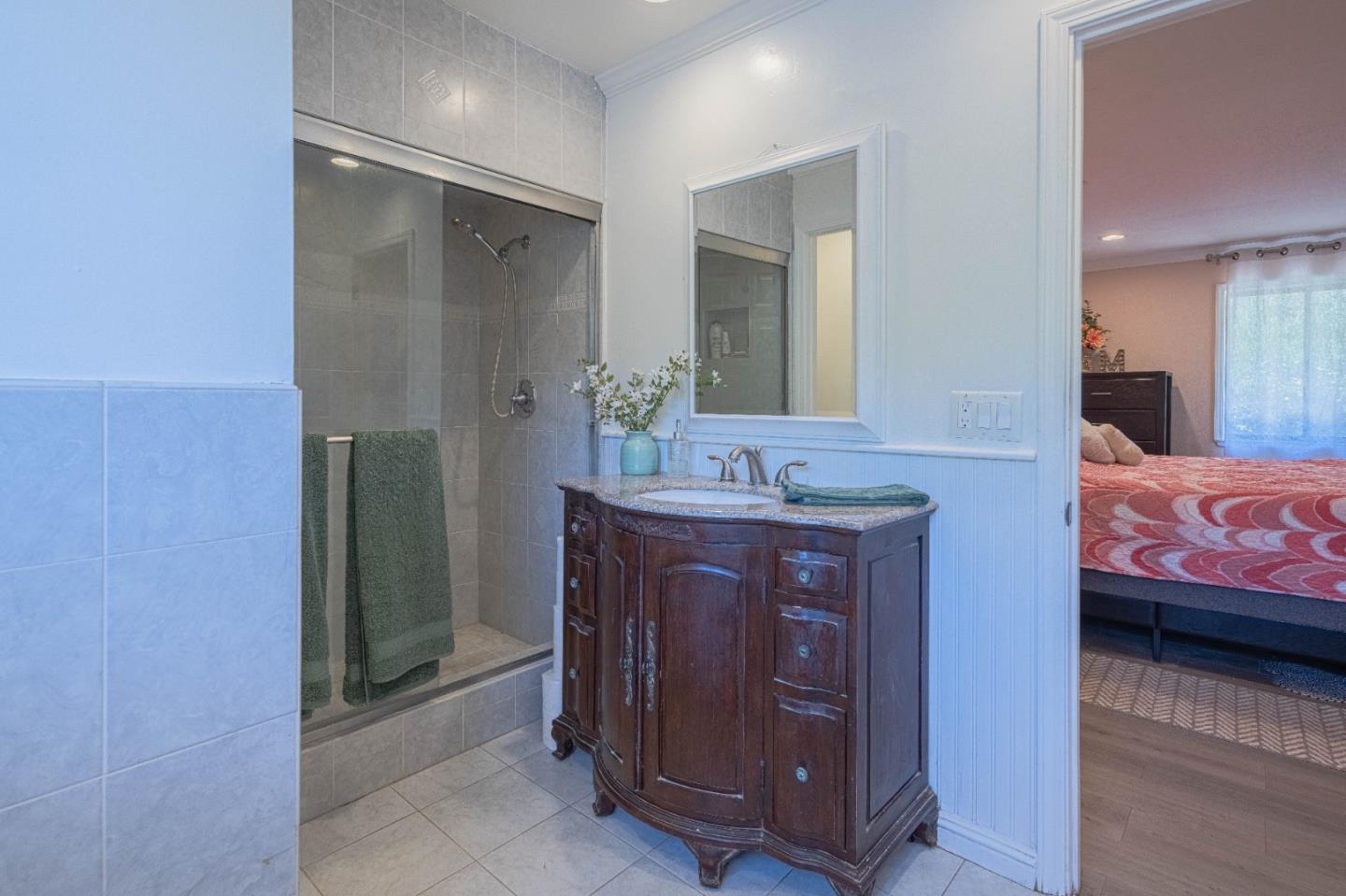 5240 Strong Circle Watsonville, CA 95076 - Photo 27 of 51 a bathroom with a granite countertop sink and a mirror
