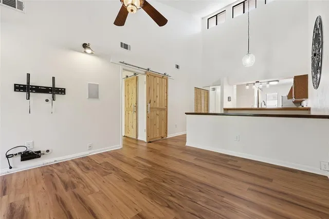 a view of a kitchen with a sink and cabinets