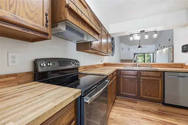 a kitchen with a stove and a sink