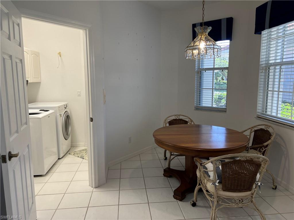 2081 Crestview Way, Unit A7 Naples, FL 34119 - Photo 13 of 33 a dining room with furniture and window