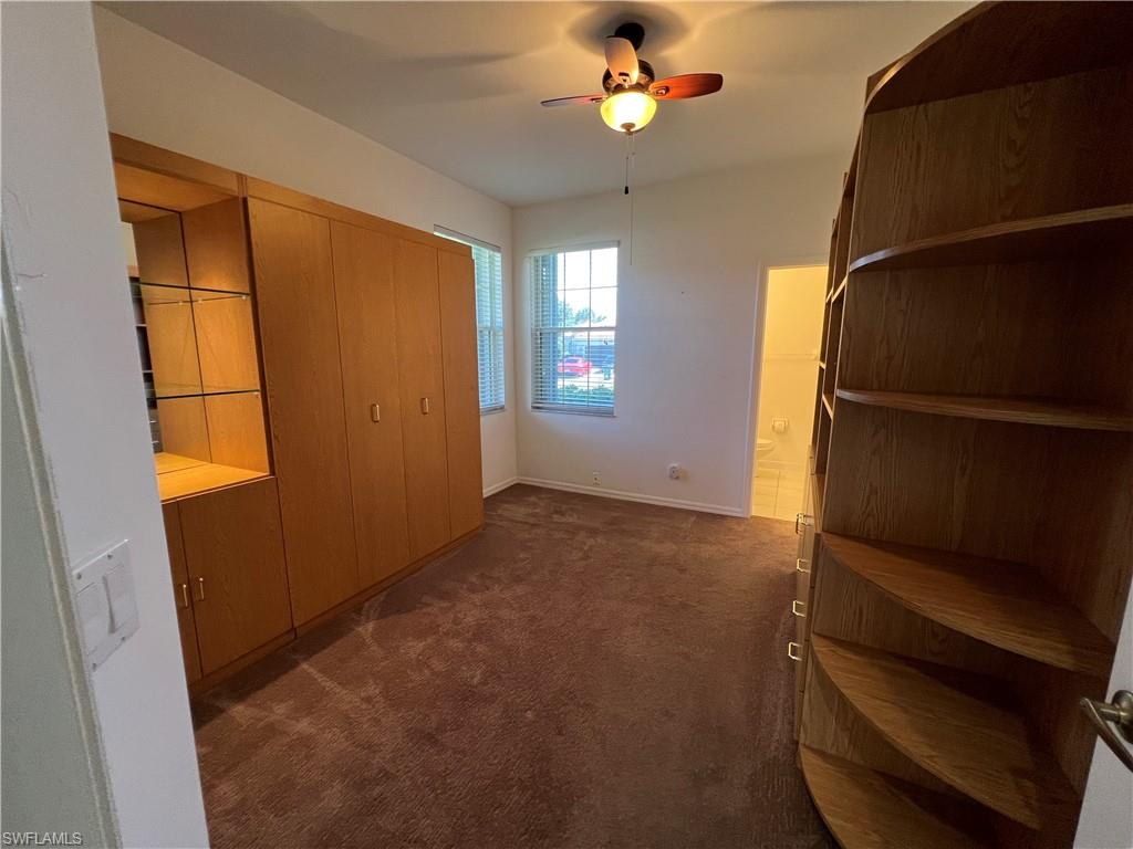 2081 Crestview Way, Unit A7 Naples, FL 34119 - Photo 19 of 33 a view of empty room with window and ceiling fan