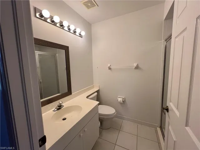 a bathroom with a shower and toilet