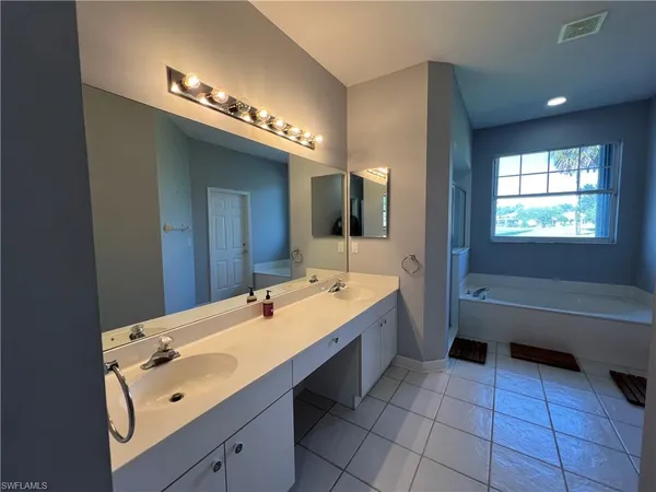 a bath tub sitting next to a window