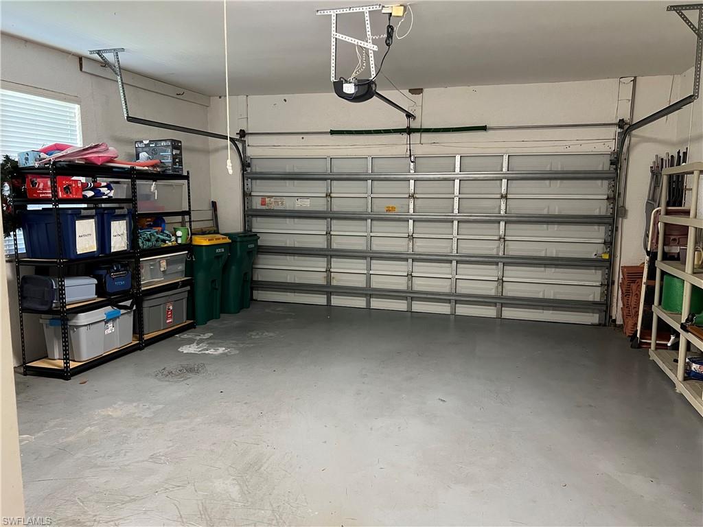 2081 Crestview Way, Unit A7 Naples, FL 34119 - Photo 33 of 33 a view of a garage with storage