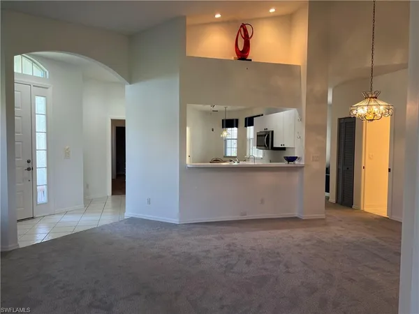 a kitchen with a sink and a stove top oven