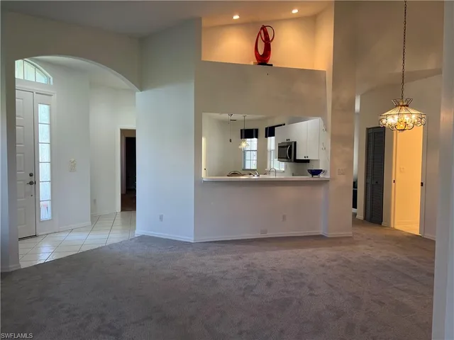 a kitchen with a sink and a stove top oven