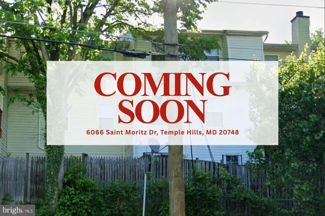 a sign that is on a brick wall with a street sign on the wall