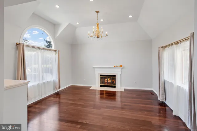 a view of livingroom with hardwood floor and a ceiling fan
