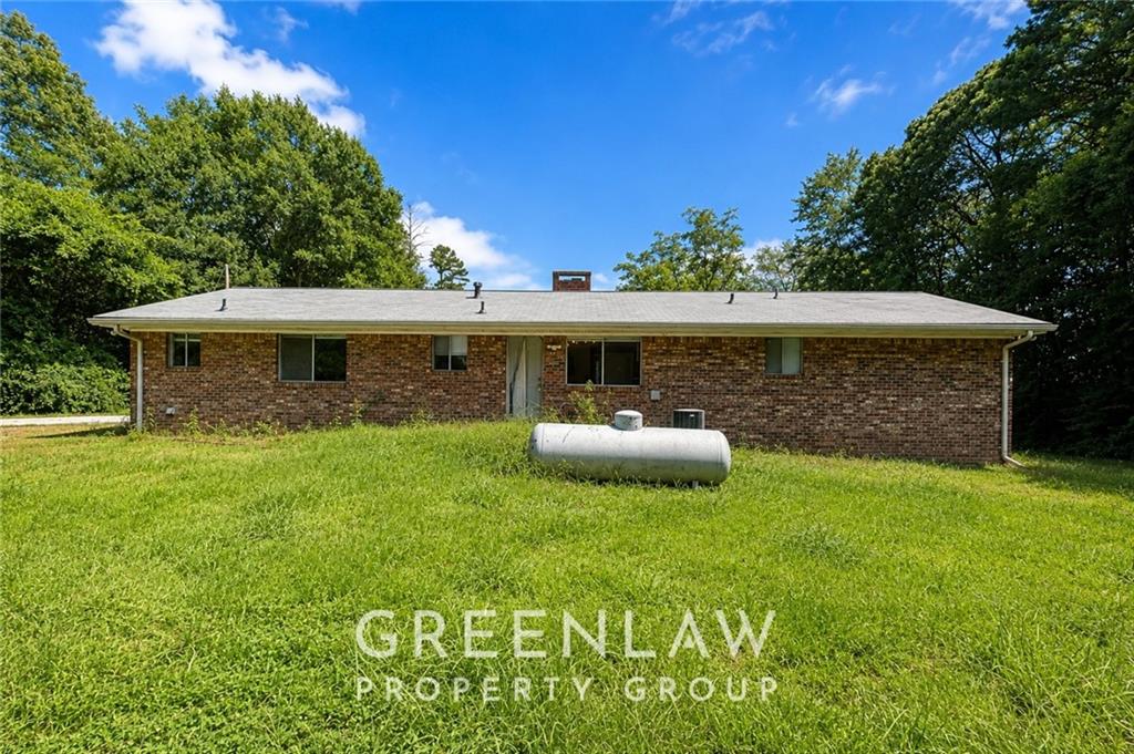3605 Flat Shoals Road Atlanta, GA 30349 - Photo 35 of 35 a view of a house with backyard