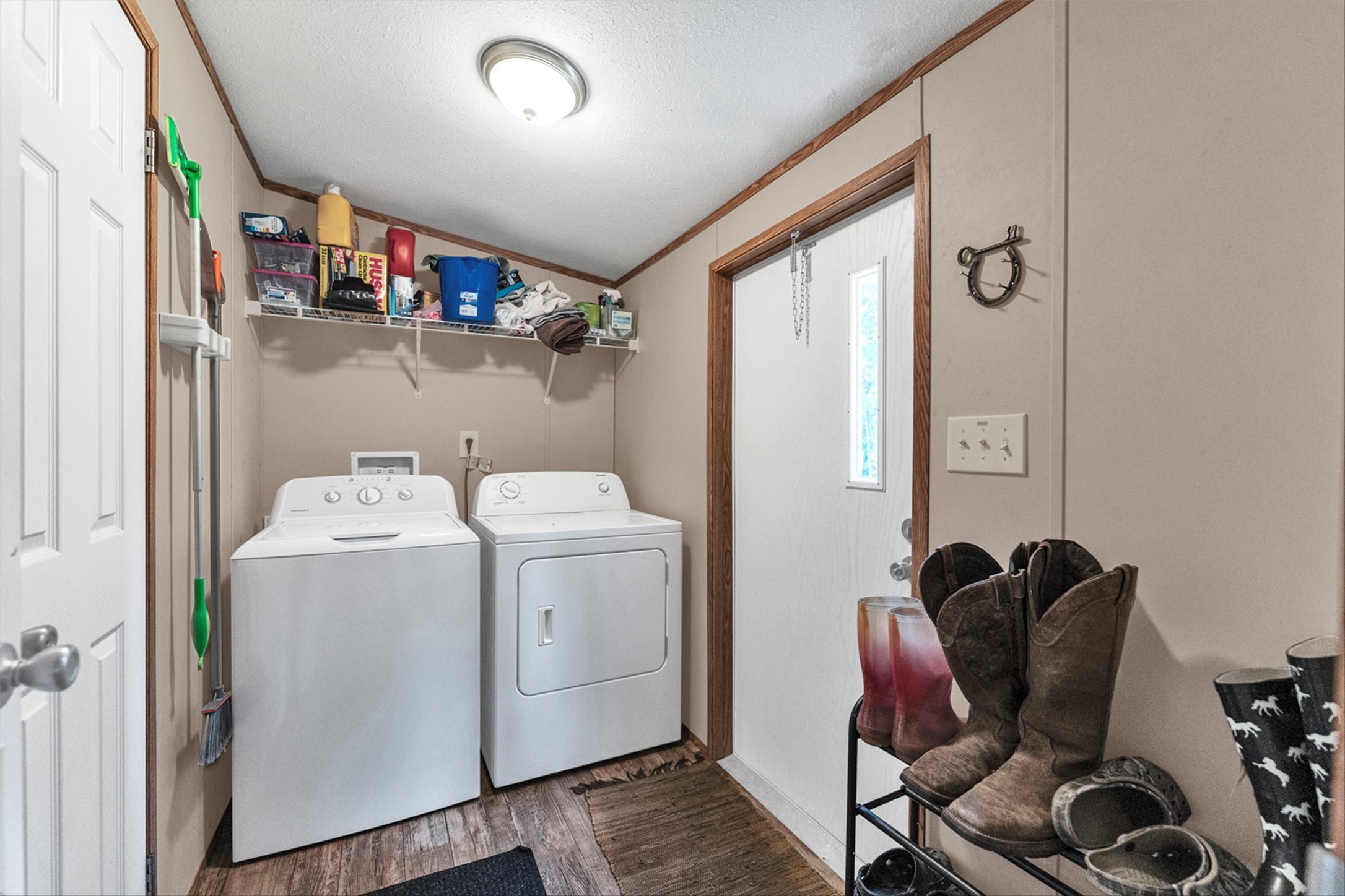 50 Fm 3179 Road Huntsville, TX 77320 - Photo 18 of 45 Conveniently positioned utility room offers additional storage potential and quick outdoor access.